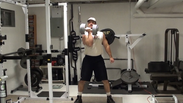 Build Serious Core Strength With One-Dumbbell Curl Squats Top