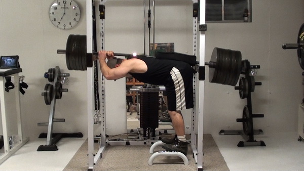 Donkey Calf Raise in the rack with a barbell Bottom