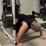 Barbell-Weighted Push-Up Lockouts