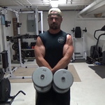 Build Wider Side Delts With Cross-Over Carries