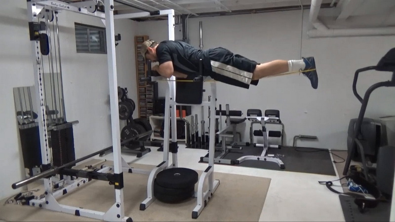 Reverse Hyperextensions on the Ab Chair for Posterior Chain Work and Lower Back Traction Top