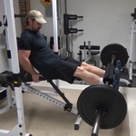 Barbell Leg Extensions for Quadricep Isolation in a Home Gym