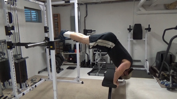 Elevated Pike Handstand Push-Ups for Bodyweight Shoulder Training midway