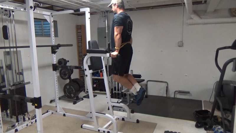 Behind-the-Back Band Dips For Building Tricep Mass Top