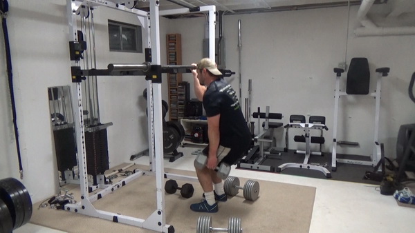 One-Arm Gripping Dumbbell Squats Light
