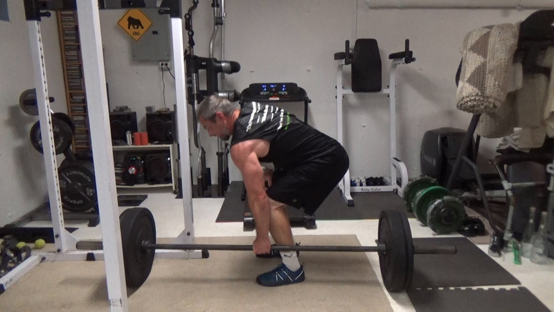 Build a Thicker Upper Back With One-Arm Suitcase Barbell Rows