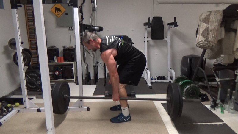 Build a Thicker Upper Back With One-Arm Suitcase Barbell Rows