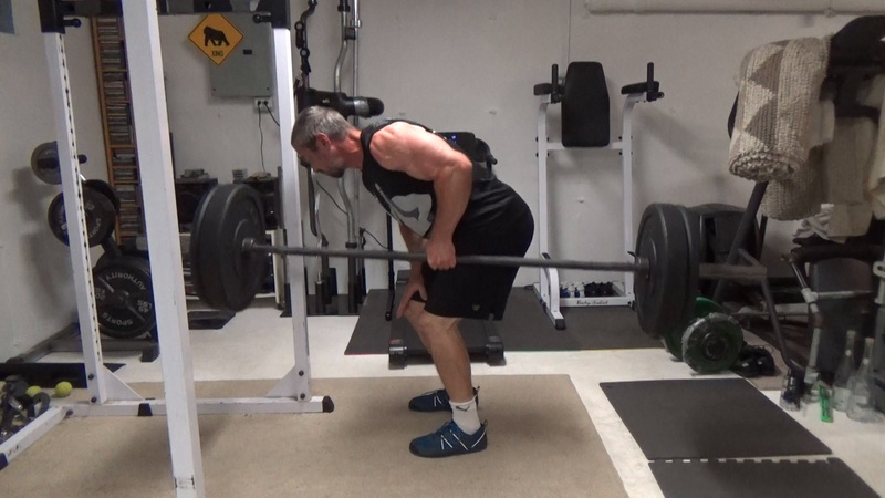 Build a Thicker Upper Back With One-Arm Suitcase Barbell Rows