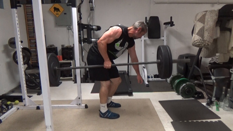 Build a Thicker Upper Back With One-Arm Suitcase Barbell Rows