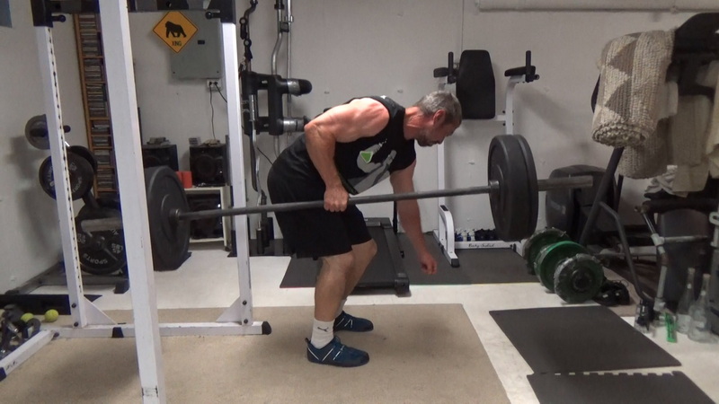Build a Thicker Upper Back With One-Arm Suitcase Barbell Rows