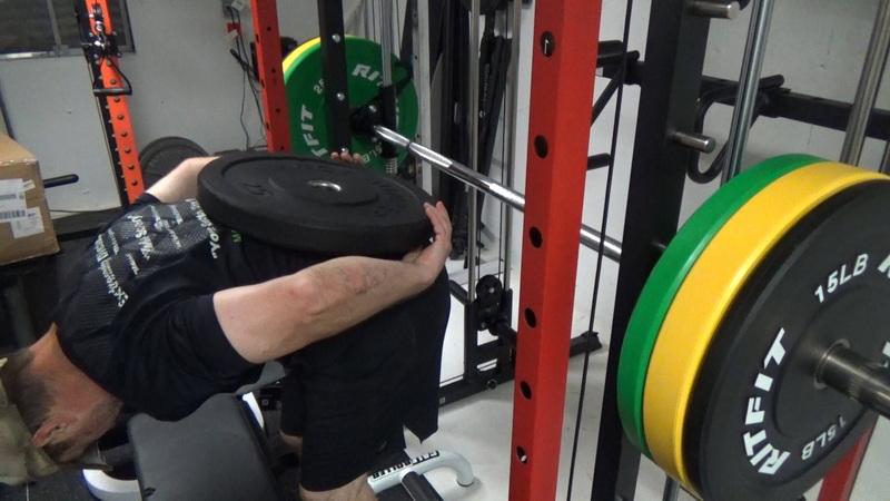 Smith Machine Donkey Calf Raises With a Bumper Plate on back