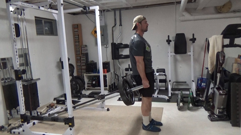 Two Barbell Landmine Shrugs for Traps Facing Away