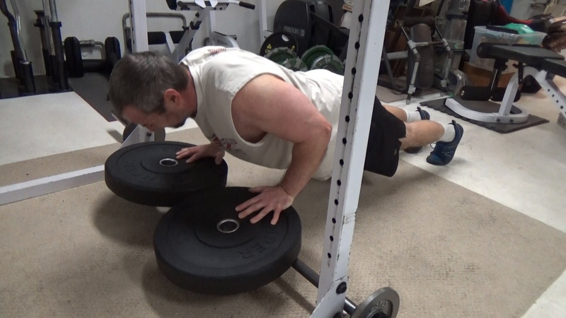 Plate-Leverage Close Grip Push-Ups