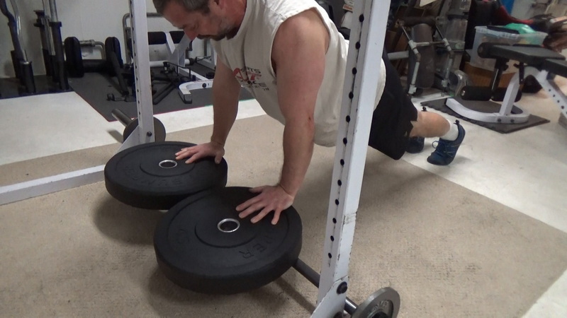 Plate-Leverage Close Grip Push-Ups